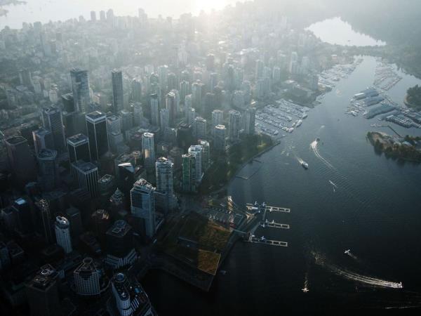 Commercial and residential buildings stand in this aerial photograph taken above Vancouver, British Columbia, Canada, on Thursday, Sept. 6, 2018. Canadian commercial real estate investment reached new heights in the second quarter, boosted by a pair of big acquisitions and by the lure of attractive, income-producing property. Photographer: James MacDonald/Bloomberg